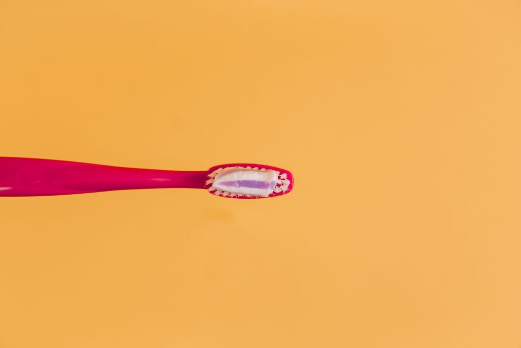 Toothbrush on Yellow Background